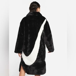Full length faux fur Nike swoosh emblem coat